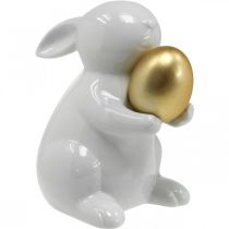 Triušis su auksinio kiaušinio keramika, Velykų puošmena elegantiška balta, auksinė H15cm
