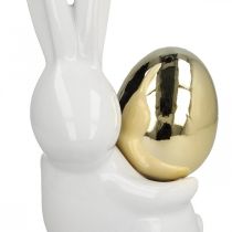 Velykiniai zuikiai elegantiški, keramikiniai zuikiai su auksiniu kiaušiniu, Velykų puošmena balta, auksinė A18cm 2vnt.
