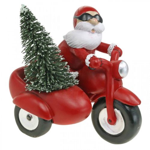Dekoratyvinė Kalėdų Senelio figūrėlė ant motociklo su egle 19,5×13×16 cm